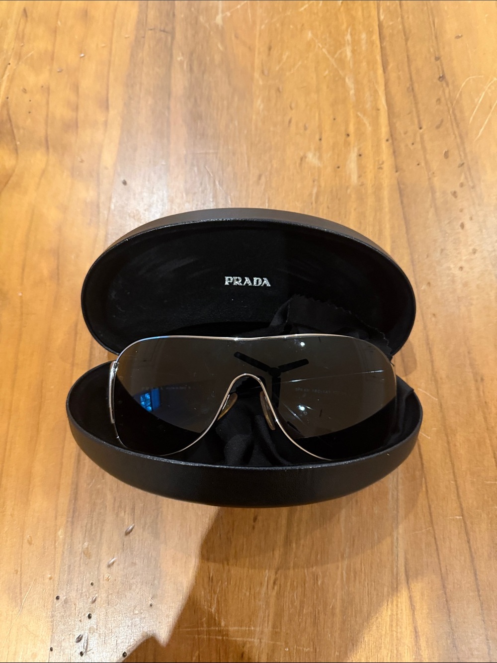 Prada women’s  Shield Sunglasses in Black